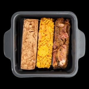 Three-part frozen meal in a charcoal dish