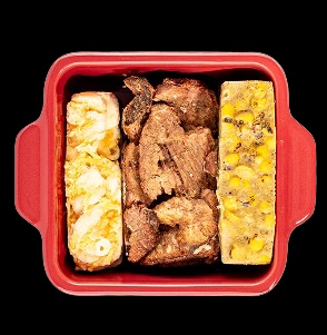Three-part frozen meal in a red dish